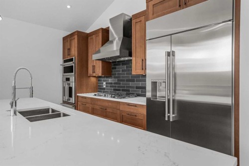 401 Stewart Creek Close, Canmore, AB - Indoor Photo Showing Kitchen With Double Sink With Upgraded Kitchen