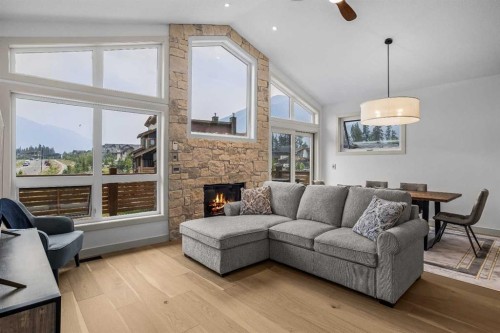 401 Stewart Creek Close, Canmore, AB - Indoor Photo Showing Living Room With Fireplace