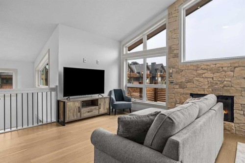 401 Stewart Creek Close, Canmore, AB - Indoor Photo Showing Living Room With Fireplace