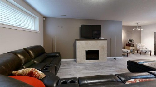 47 Rodeo Way, Whitecourt, AB - Indoor Photo Showing Living Room With Fireplace