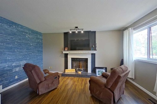 4609 Champagne Drive, Athabasca, AB - Indoor Photo Showing Living Room With Fireplace