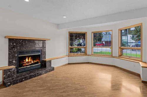 522 Grotto Road, Canmore, AB - Indoor Photo Showing Living Room With Fireplace