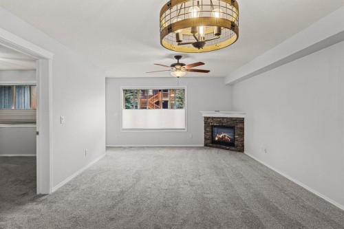 120-300 Palliser Lane, Canmore, AB - Indoor With Fireplace