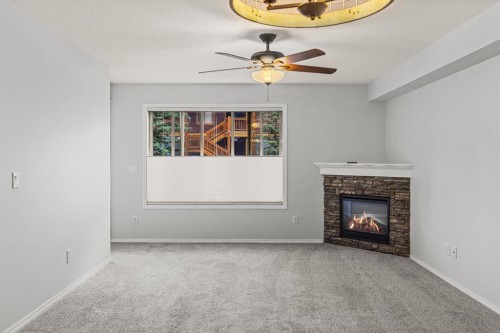 120-300 Palliser Lane, Canmore, AB - Indoor With Fireplace