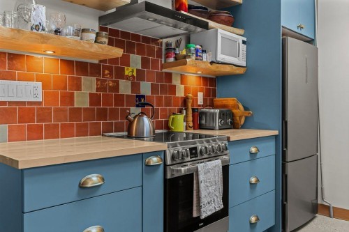 A And B-132 Rundle Crescent, Canmore, AB - Indoor Photo Showing Kitchen