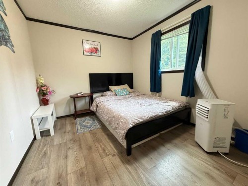 8 131074 Twp Rd 590, Rural Woodlands County, AB - Indoor Photo Showing Bedroom