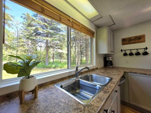 14 Marten Drive, Marten Beach, AB - Indoor Photo Showing Kitchen With Double Sink