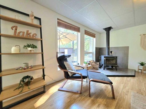14 Marten Drive, Marten Beach, AB - Indoor Photo Showing Other Room With Fireplace
