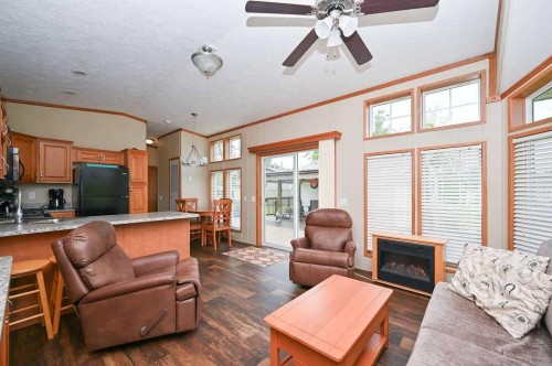 167 Shank Drive, Island Lake South, AB - Indoor Photo Showing Living Room With Fireplace