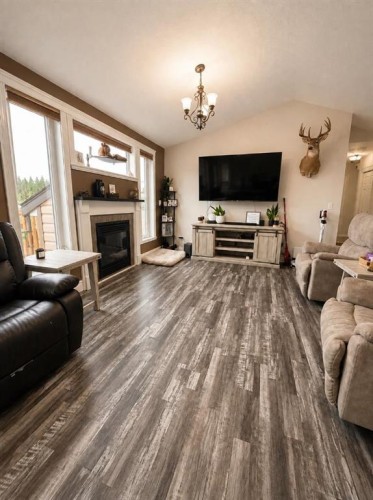 66 Cedar Heights, Whitecourt, AB - Indoor Photo Showing Living Room With Fireplace