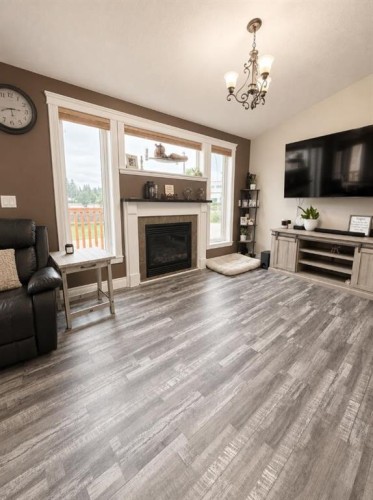 66 Cedar Heights, Whitecourt, AB - Indoor Photo Showing Living Room With Fireplace