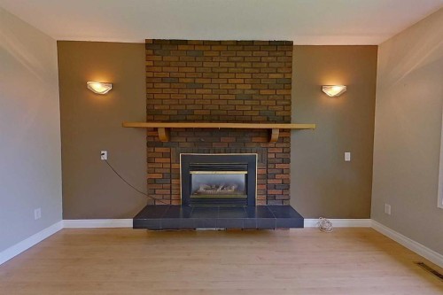 4920 59 Street, Athabasca, AB - Indoor Photo Showing Living Room With Fireplace