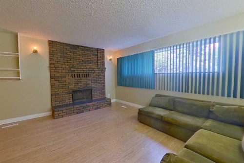 4920 59 Street, Athabasca, AB - Indoor Photo Showing Living Room With Fireplace