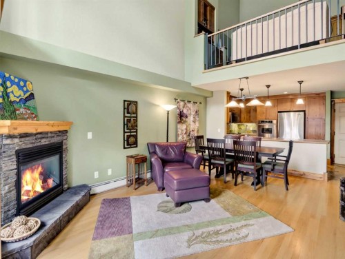 307-155 Crossbow Place, Canmore, AB - Indoor Photo Showing Living Room With Fireplace