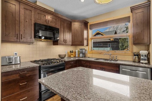 516 8Th Avenue, Canmore, AB - Indoor Photo Showing Kitchen With Double Sink With Upgraded Kitchen