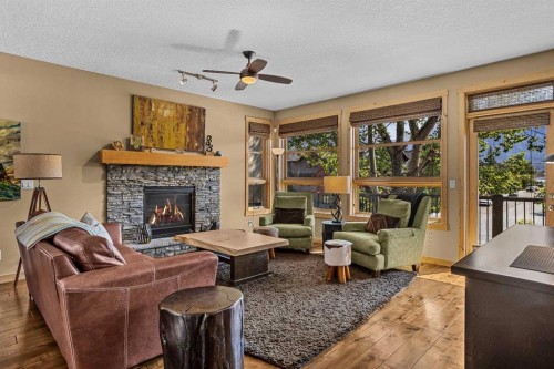 516 8Th Avenue, Canmore, AB - Indoor Photo Showing Living Room With Fireplace