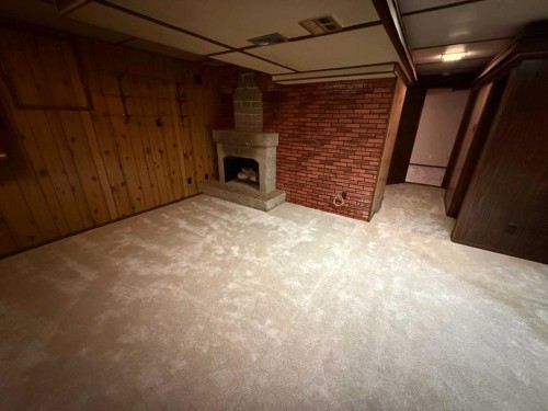 105 Poplar Place, Hinton, AB - Indoor Photo Showing Other Room With Fireplace