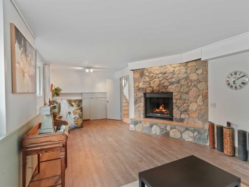 22 Pinewood Crescent, Canmore, AB - Indoor Photo Showing Living Room With Fireplace