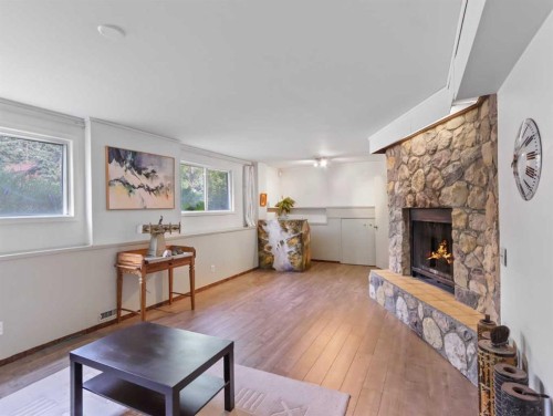 22 Pinewood Crescent, Canmore, AB - Indoor Photo Showing Living Room With Fireplace