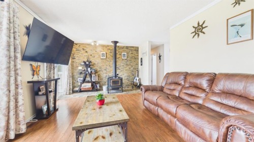 74008 Southshore Drive, Widewater, AB - Indoor Photo Showing Living Room With Fireplace