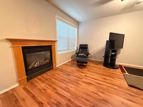 103-501 3 Street, Fox Creek, AB - Indoor Photo Showing Living Room With Fireplace