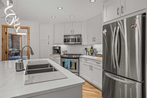 205-600 Spring Creek Drive, Canmore, AB - Indoor Photo Showing Kitchen With Double Sink With Upgraded Kitchen