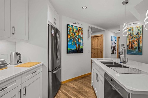 205-600 Spring Creek Drive, Canmore, AB - Indoor Photo Showing Kitchen With Double Sink With Upgraded Kitchen