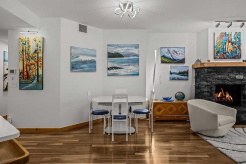 205-600 Spring Creek Drive, Canmore, AB - Indoor With Fireplace