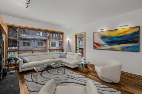 205-600 Spring Creek Drive, Canmore, AB - Indoor Photo Showing Living Room