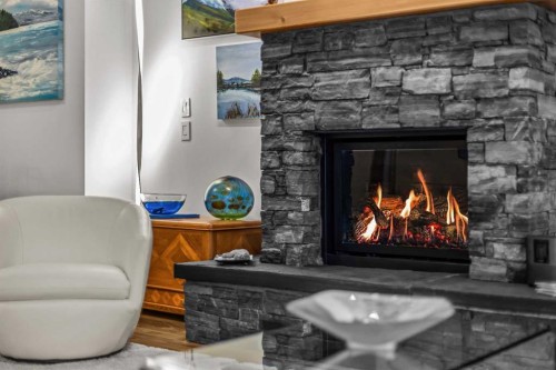 205-600 Spring Creek Drive, Canmore, AB - Indoor With Fireplace