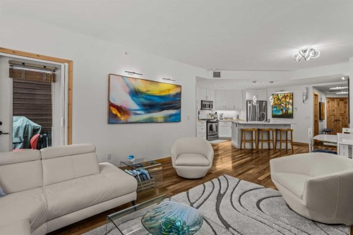 205-600 Spring Creek Drive, Canmore, AB - Indoor Photo Showing Living Room