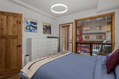 205-600 Spring Creek Drive, Canmore, AB - Indoor Photo Showing Bedroom