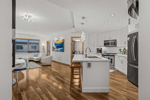 205-600 Spring Creek Drive, Canmore, AB - Indoor Photo Showing Kitchen With Upgraded Kitchen