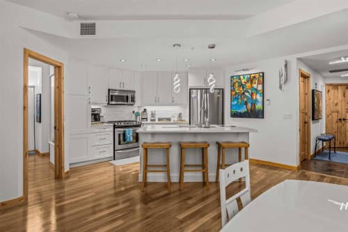 205-600 Spring Creek Drive, Canmore, AB - Indoor Photo Showing Kitchen With Upgraded Kitchen