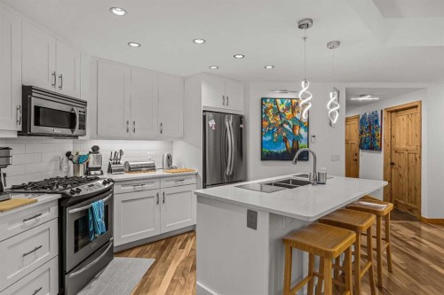 205-600 Spring Creek Drive, Canmore, AB - Indoor Photo Showing Kitchen With Double Sink With Upgraded Kitchen