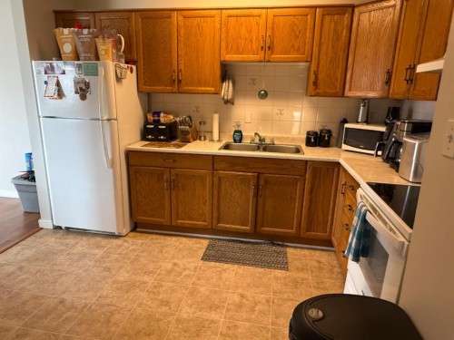 59 A&B Centennial Crescent, Swan Hills, AB - Indoor Photo Showing Kitchen With Double Sink