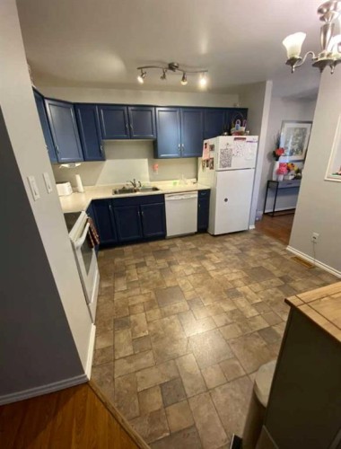 59 A&B Centennial Crescent, Swan Hills, AB - Indoor Photo Showing Kitchen With Double Sink