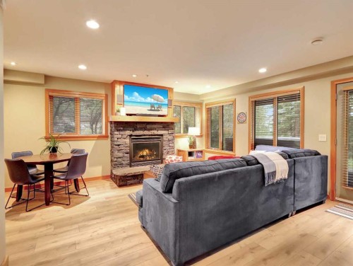 11-137 Wapiti Close, Canmore, AB - Indoor Photo Showing Living Room With Fireplace