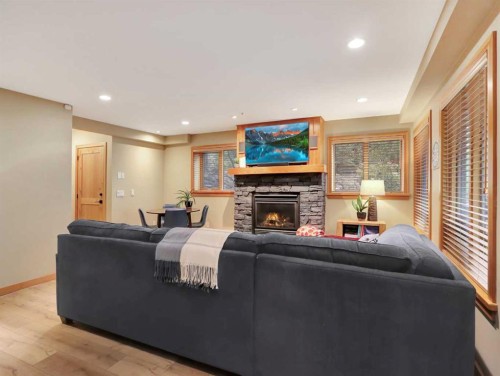 11-137 Wapiti Close, Canmore, AB - Indoor Photo Showing Living Room With Fireplace