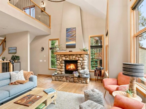11-137 Wapiti Close, Canmore, AB - Indoor Photo Showing Living Room With Fireplace