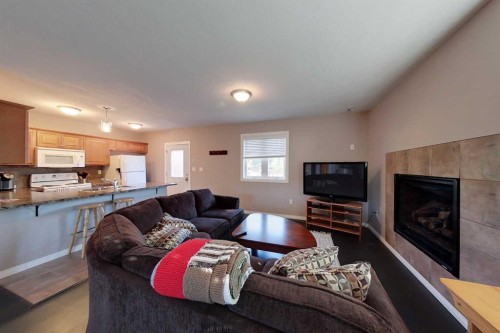734041 Range Road, Wagner, AB - Indoor Photo Showing Living Room With Fireplace