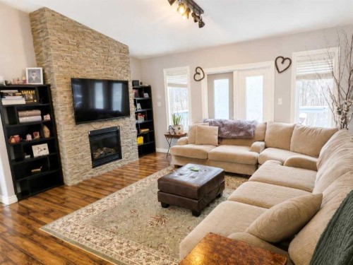 170 David Drive, Whispering Hills, AB - Indoor Photo Showing Living Room With Fireplace
