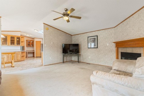 54 Aspen Drive West, Athabasca, AB - Indoor Photo Showing Living Room With Fireplace