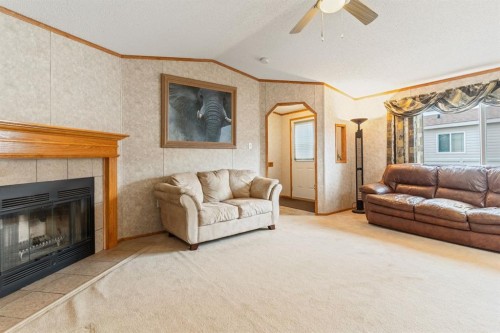 54 Aspen Drive West, Athabasca, AB - Indoor Photo Showing Living Room With Fireplace