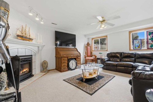 46 Atkinson Crescent, Whitecourt, AB - Indoor Photo Showing Living Room With Fireplace