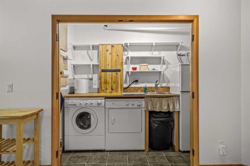 10 Heart Road, Lac Des Arcs, AB - Indoor Photo Showing Laundry Room