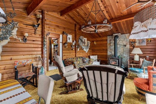 237 Cascade Drive, Harvie Heights, AB - Indoor Photo Showing Other Room With Fireplace