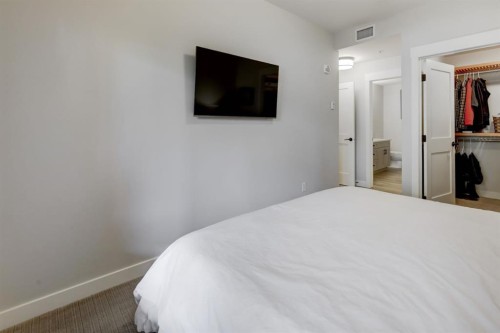 107-707 Spring Creek Drive, Canmore, AB - Indoor Photo Showing Bedroom