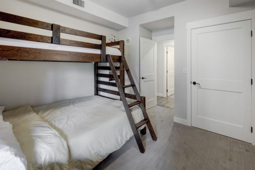 107-707 Spring Creek Drive, Canmore, AB - Indoor Photo Showing Bedroom
