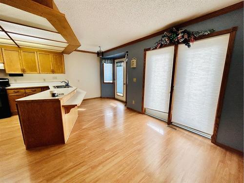 211 7 Avenue East, Oyen, AB - Indoor Photo Showing Kitchen With Double Sink